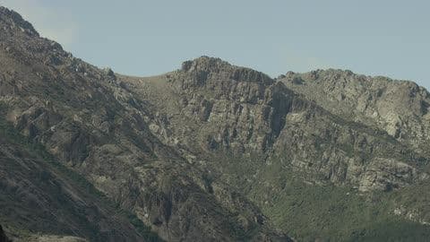 Mountain Range Sits Under the Blue Sky