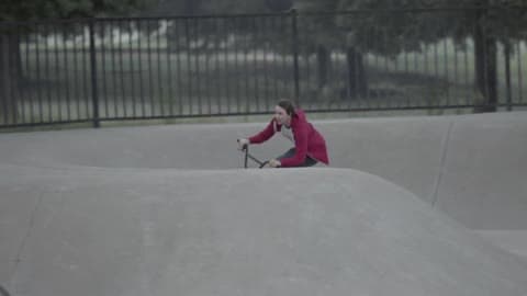 A Bicyclist Jumps And Rides Through A Skate Park