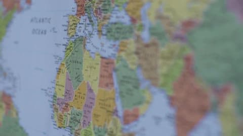 A Close View Of The World Map Which Is Hung On The Wall