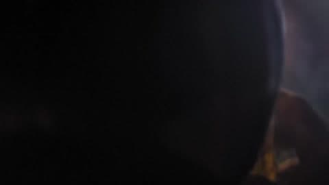 A Man Lights A Cigarette And Drinks