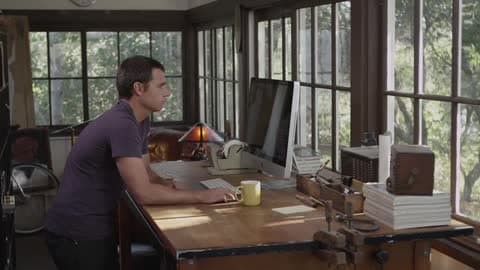 A Person Working At A Computer