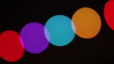 Brightly Colored Circles Moving In A Chain