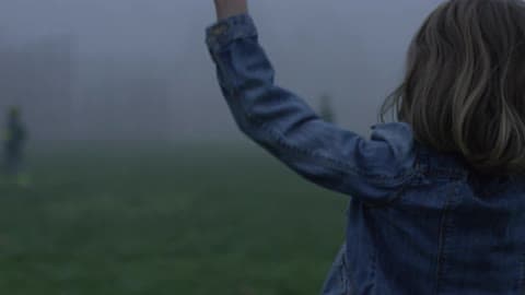 Girl Jumping And Waving Pom Poms Cheering For Team