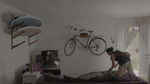 Man Picks Up The Surfboard And Gets Out Of The House