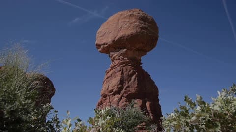 Old Rock Formation Just Out Against Blue Sky