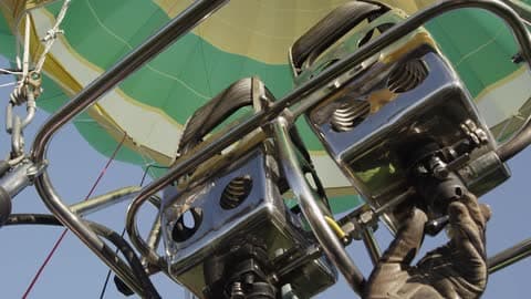 Person Turns On The Fire Mechanism In A Hot Air Balloon